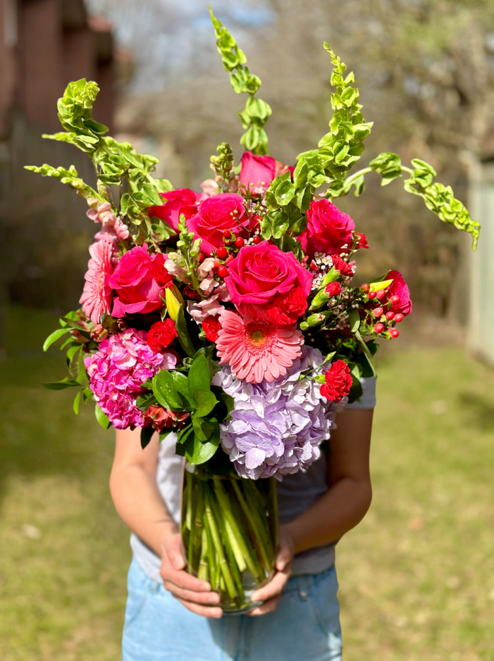 Image: Bloom and Petals Signature Vase Arrangement featuring premium blooms in a beautiful vase.