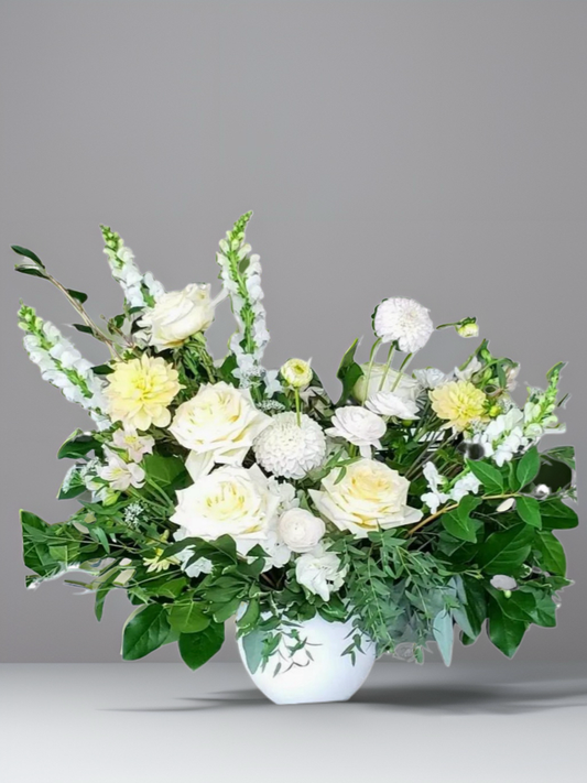 hite and green floral arrangement from Bloom & Petals Oakville flower shop, featuring fresh white flowers and vibrant green foliage.